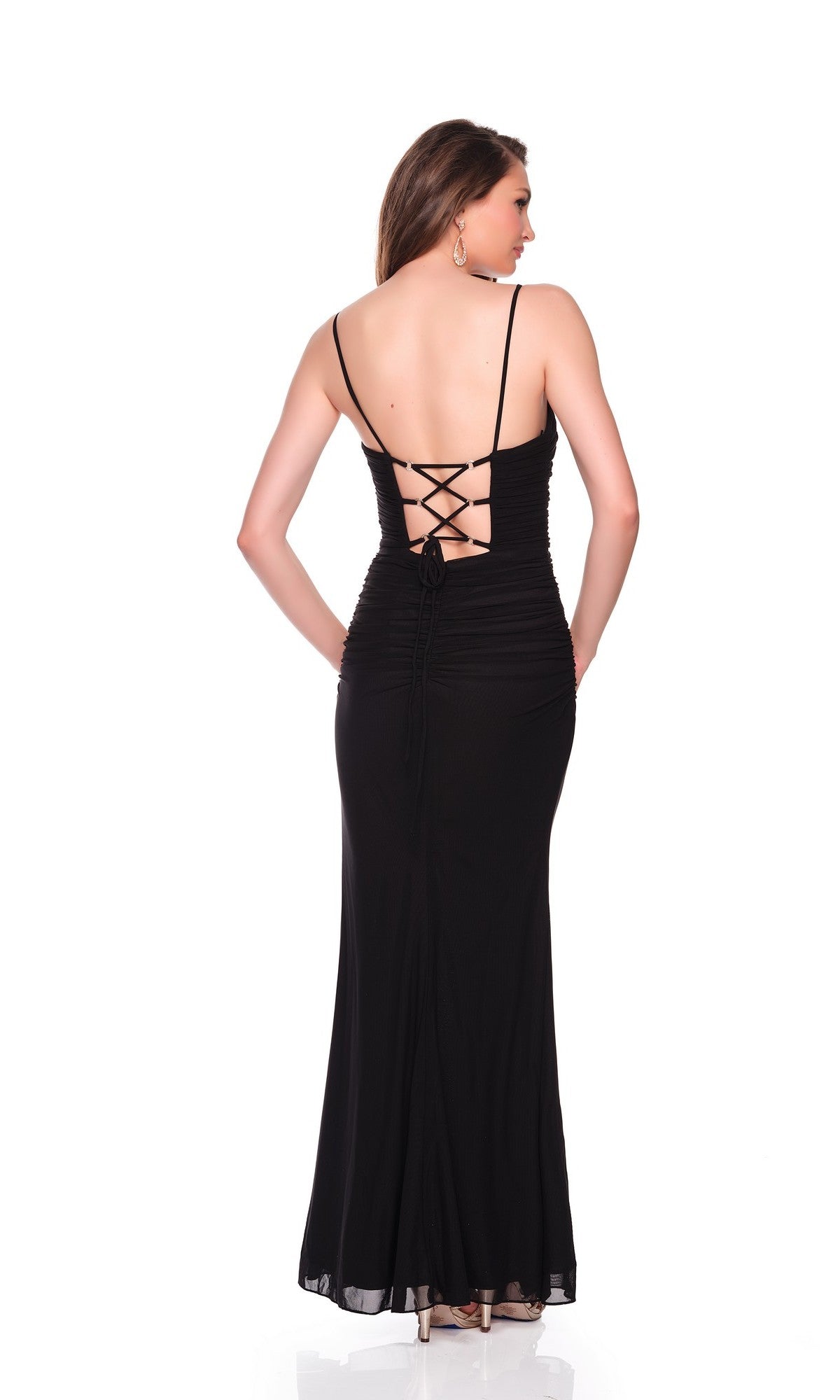 A woman stands facing away against a white background, wearing the Long Prom Dress: Dave and Johnny 12849— a black ruched mesh gown featuring a lace-up back detail.